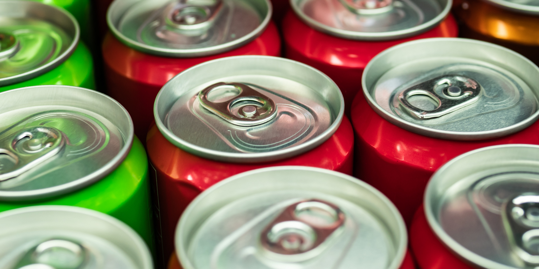 closeup view of top of happy belly kombucha cans